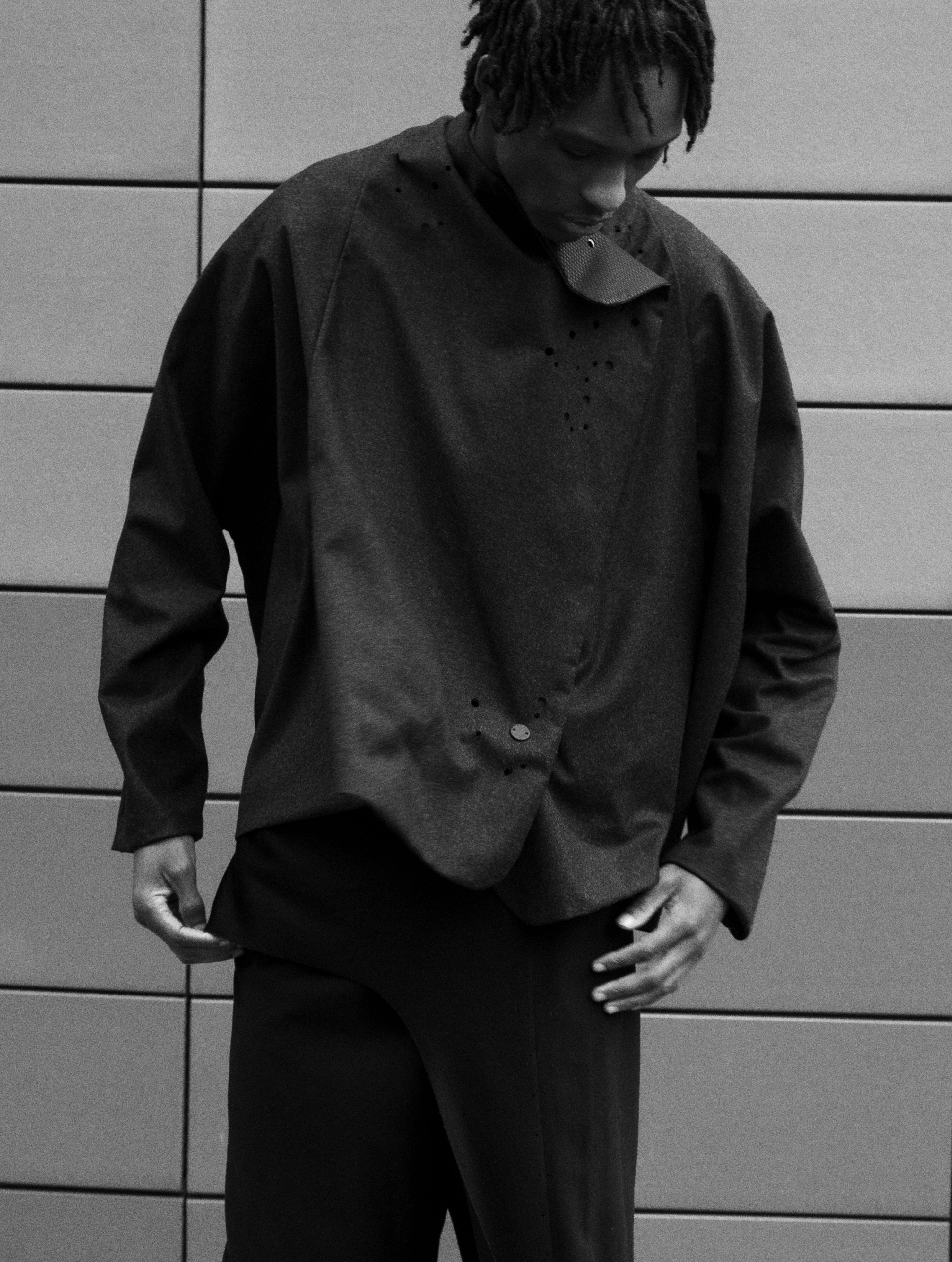 Mens waterproof wool jacket with kimono sleeve by Savvas Alexander.